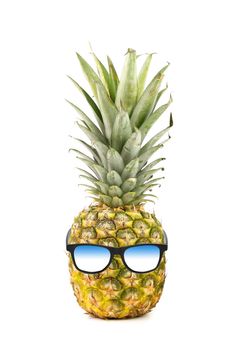 Funny pineapple with sunglasses isolated on a white background
