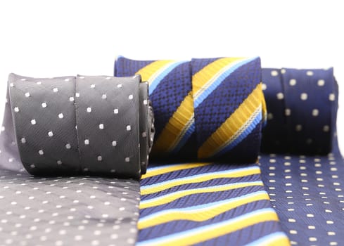 Three rolled up necktie isolated on white background.