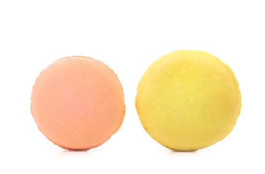 Two various macarons isolated on a white background .