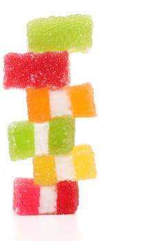 Spyral colorful jelly candies on a white background.
