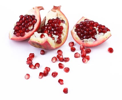 Broken pomegranate segment isolated on white background