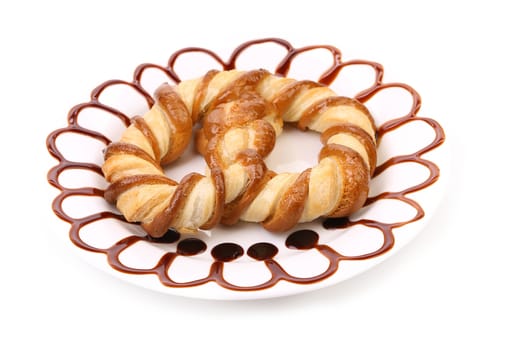 Freshly fancy pretzel baked in a white plate.