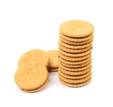 Closeup of a stack of filled cookies on white background