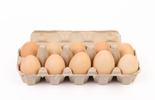 Ten brown eggs in a paper egg box.