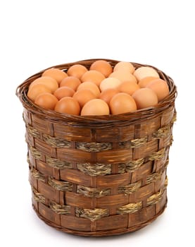 Eggs in a deep brown basket. Isolated