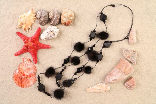 Summer concept - sand stones and seashells frame necklace
