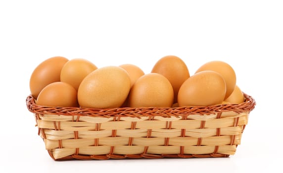Full basket off eggs. In a white background