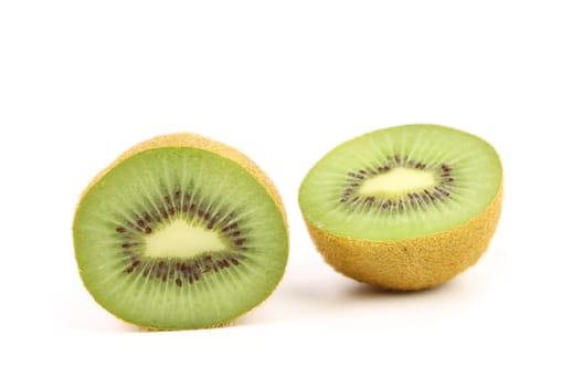 Two halfs of kiwi fruit isolated on white background