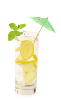 Glass of lemonade with lemon and mint. Isolated on white