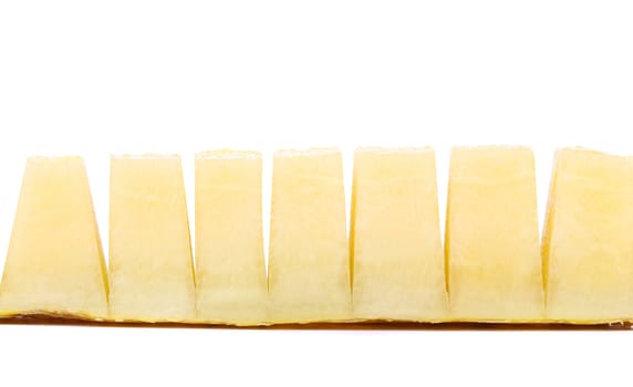 Slices of melon on a white background