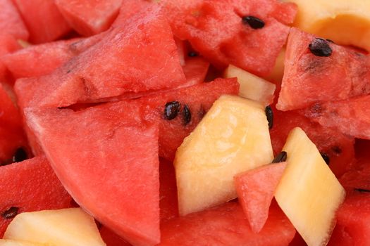 Background with pieces of watermelon and melon