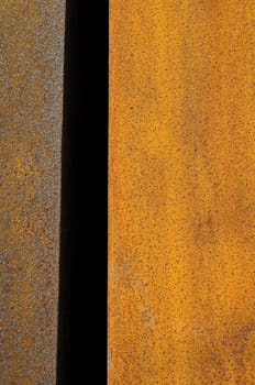 Orange Patterns on the Rusty Surface of the Metal