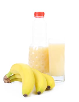 Glass and bottle of juice. Bananas. White background.
