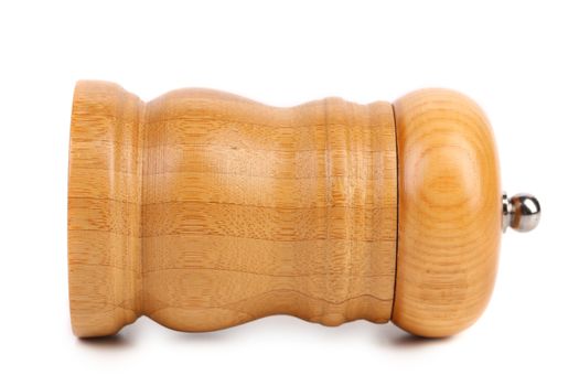 Wooden pepper or salt pot. On a white