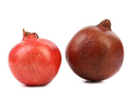 Two different pomegranates. Isolated on a white background.