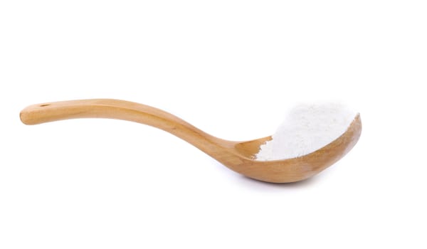 Flour on a wooden spoon. Isolated on White Background