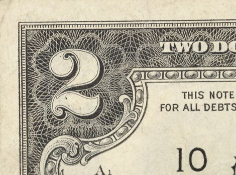 Two dollar bill close-up on a white background.