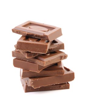 Close up of chocolate pieces on white background