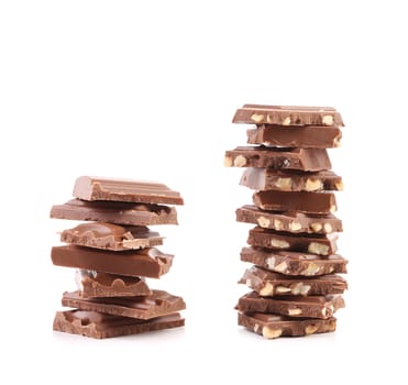 Two stacks of chocolate, one with nuts, another without nuts