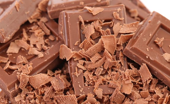 close up of chocolate pieces on white background