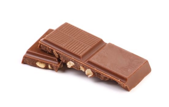 Three pieces of chocolate with milk and nuts.