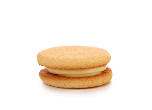 Biscuit sandwich with white filling. Close up.