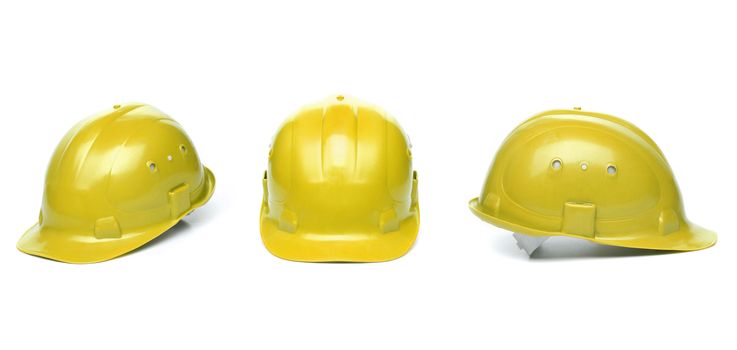 Collagr of yellow hard hats isolated on white background