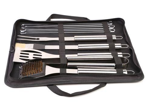 Set of tools for bbq in black bag. White background.