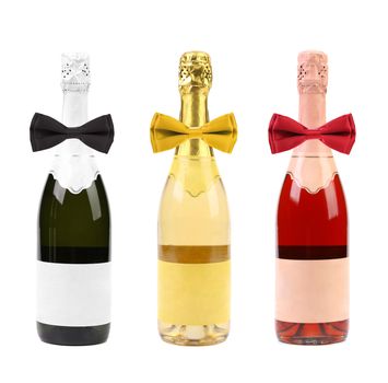 Champagne bottles and bows. Isolated on a white background.