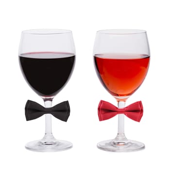 Glasses of wine decorated with bows. White background.