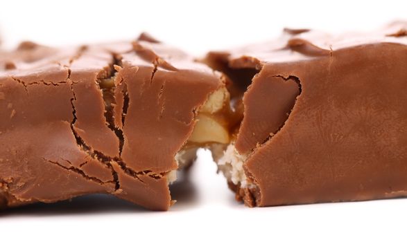 Broken chocolate bar with filling. White background.