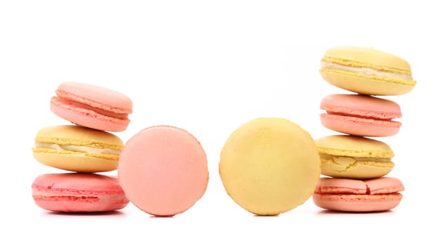 Stacks of various macaron cakes. Close up. White background.