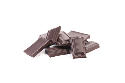 Tasty morsel of dark chocolate. Isolated on a white background.