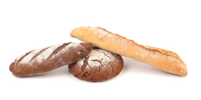 Two brown and one white breads. Isolated on a white background.