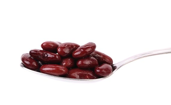 Preserve beans on a spoon. White background.