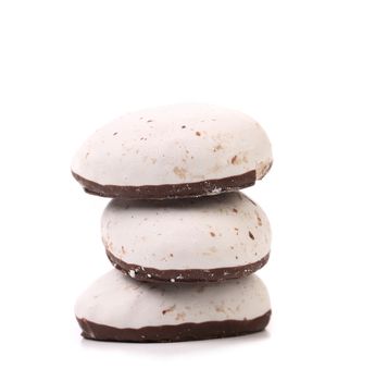 Stack of chocolate meringues. Isolated on a white background.
