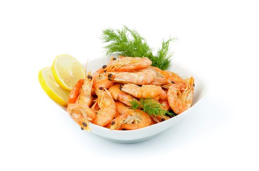 Delicious Big Boiled Shrimps Served with Dill and Lemon Slices in White Bowl isolated on white background