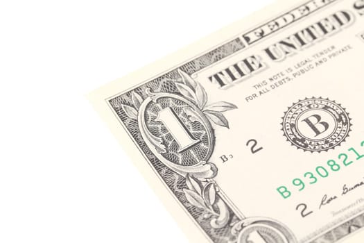 Fragment of one dollar bill. White background.