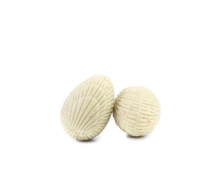Two white chocolate seashell. Isolated on a white background