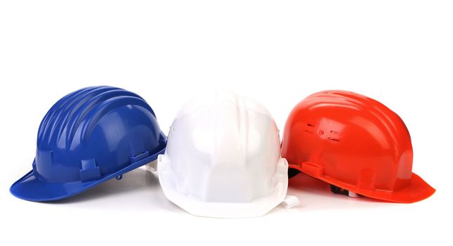 Hard hat of different colors like a flag France. Isolated on a white background.