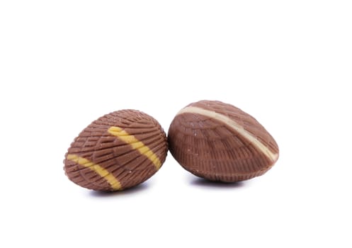 Two dark chocolate seashell. Isolated on a white background