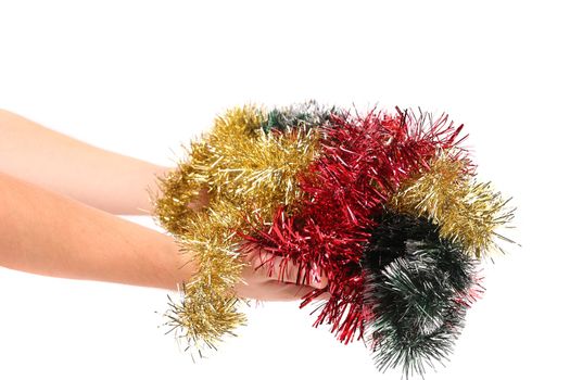 Different color tinsel on hand. Isolated on a white background.