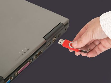 woman's hand insert usb memory stick