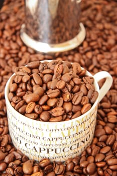 Coffee beans in a cappuccino cup