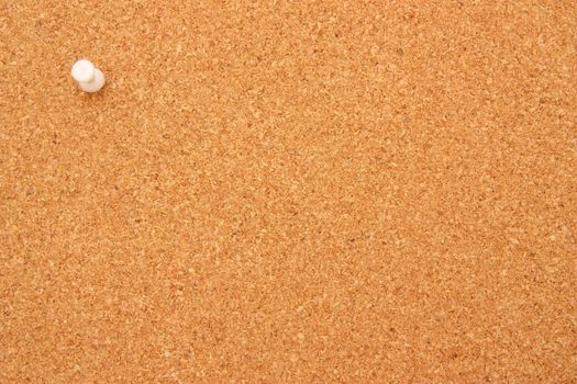 Corkboard with single white pushpin