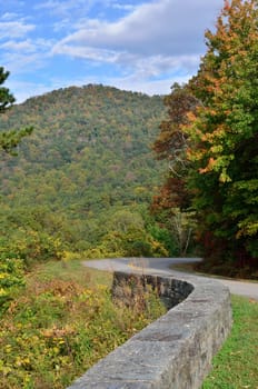 Stone wall, road, and mountain curves along the Blue Ridge Parkway