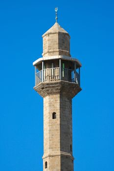 Mosque tower on blue sky background