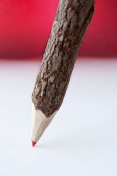 Red pencil red and white background