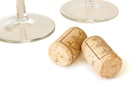 Wine cork and two wine glasses isolated on white background