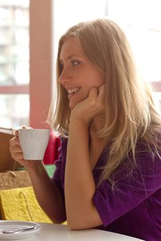 woman drinking coffee in the morning at restaurant